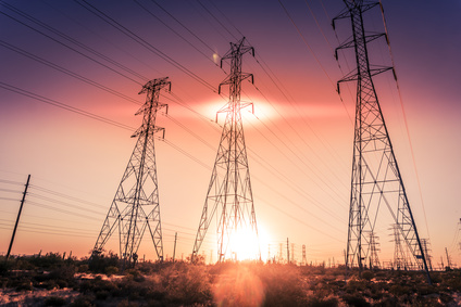 Electricity supply towers as sun sets