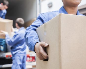 Movers unloading a moving van