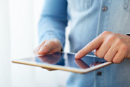 Man touching digital tablet, view close up